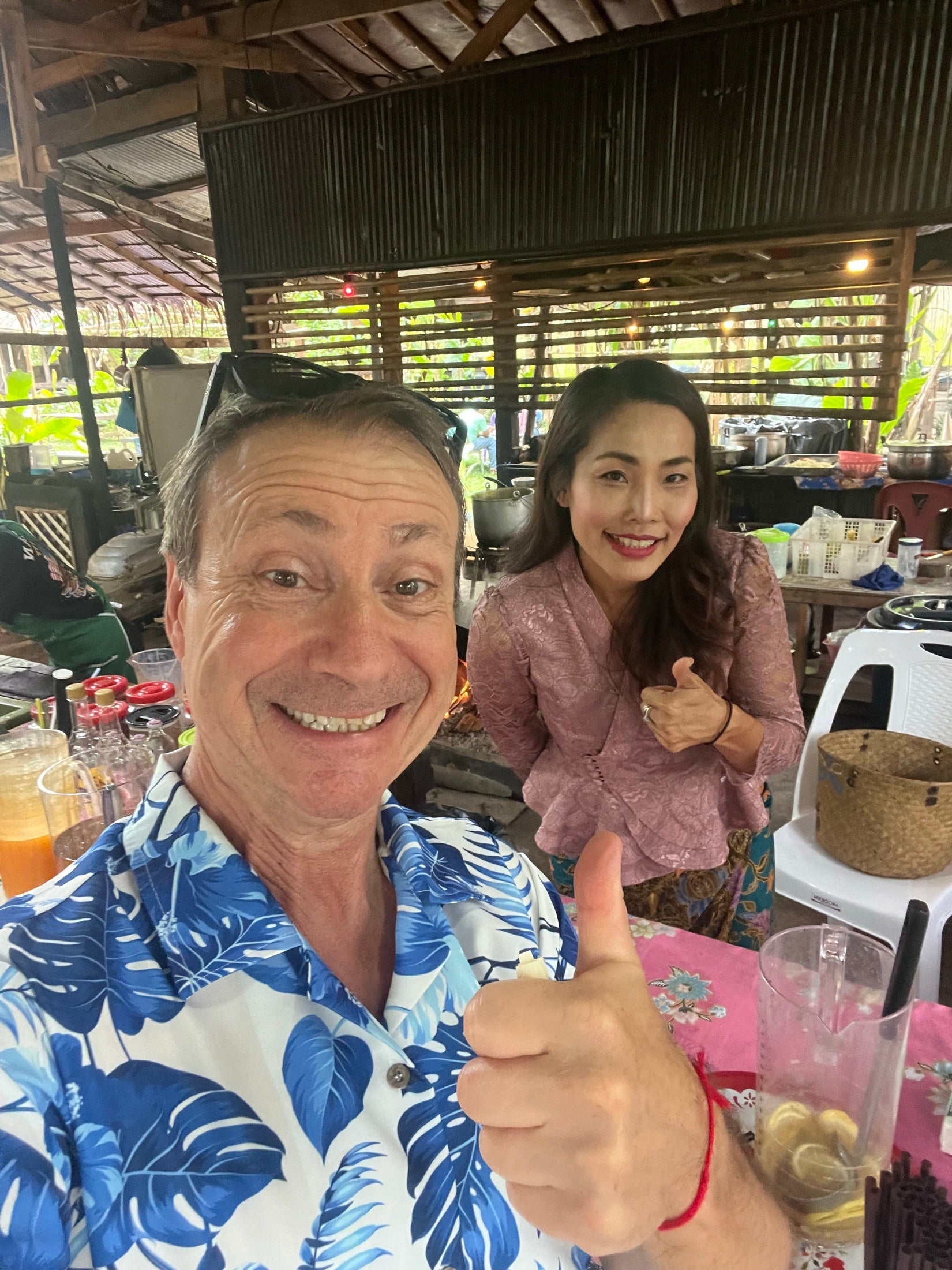 Jim and Kwan together in their village community